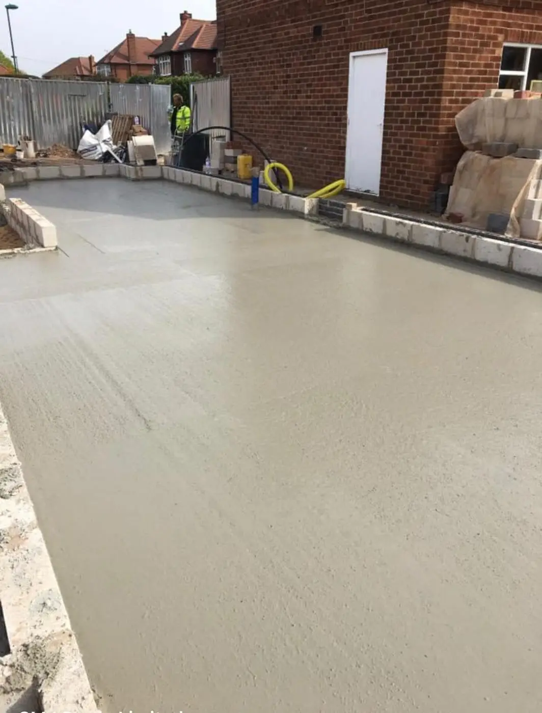 Power-floated reinforced concrete slab ready for the following trade