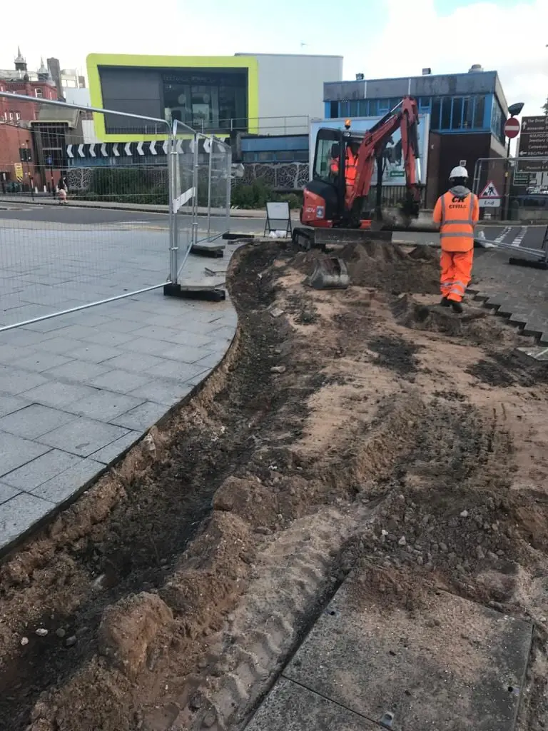 Mini excavator working a town-centre public realm scheme